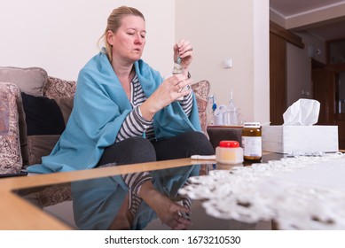 A Very Sick Woman With Temperature Drinks Warm Tea