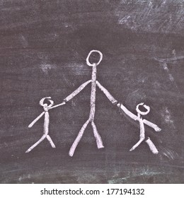 Very Simple Chalk Sketch Depicting A Single Parent With Two Young Children