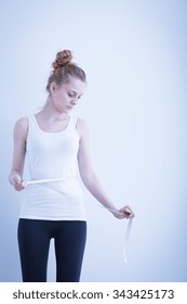 Very Slim Anorexic Girl Measuring Her Waist