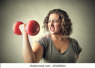 A Very Strong Woman Lifting Weights