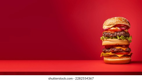 A very tall hamburger, over a red background