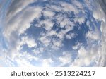 very wide sky photographed with a fisheye lens and white clouds