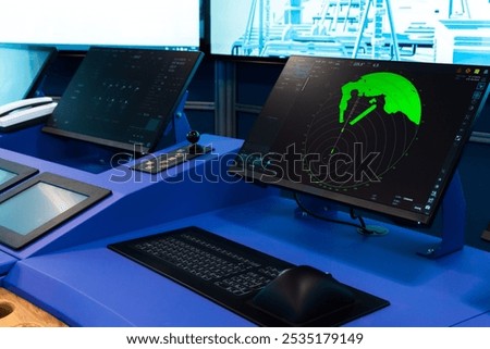 Vessel control panel with engine accelerator and radar screen, captains bridge equipment of a marine navigation simulation system
