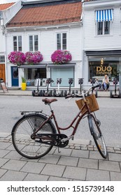 Vest-Agder, Norway - August 08, 2018: Scene With Bicycle In Front Of Houses And Shops In A Central Street Of The City Of Kristiansand