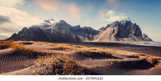Vestrahorn mountaine Stokksnes cape in Iceland during sunset  Amazing Iceland nature seascape  popular tourist attraction  Best famouse travel locations  Scenic Image Iceland