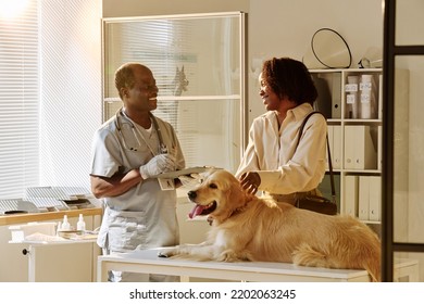 Vet Talking To Owner At Vet Clinic