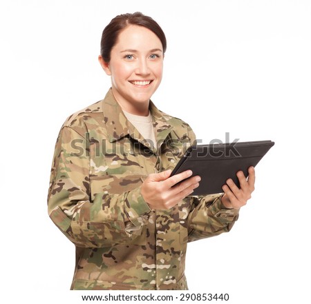 Veteran Soldier | Attractive female soldier with digital tablet wearing multicam camouflage.