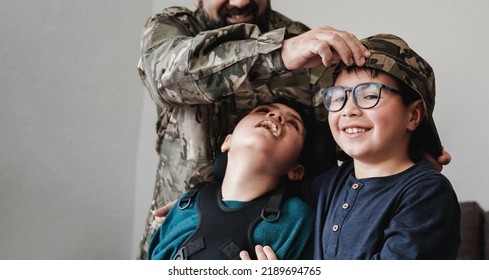 Veteran Soldier Greeting His Sons Reunited After US Army Service - Diverse Family Concept