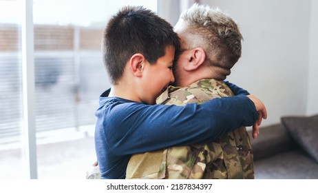 Veteran Soldier Greeting And Hugging His Son Reunited After US Army Service - Family Concept