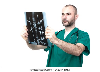 Veteran At Work Examines An Xray Of A Multiple Dog Fracture.