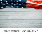 Veterans Day celebration concept, American flags on wooden background, symbolizing honor, pride, and democracy. November 11 is a day to honor our veterans.