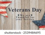 Veterans Day Thank You sign with retro red, white and blue US flag stars on weathered rustic wood