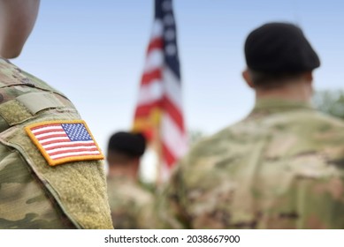 Veterans Day. US Soldiers. US Army. USA Patch Flag On The US Military Uniform. Soldiers On The Parade Ground From The Back. 