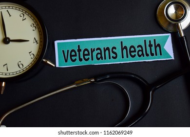 Veterans Health On The Print Paper With Healthcare Concept Inspiration. Alarm Clock, Black Stethoscope.