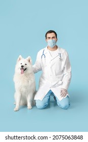 Veterinarian With Cute Dog On Color Background