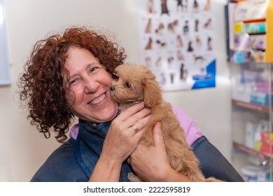 Veterinary Clinic, Portrait Of A Female Veterinarian With A Small Dog