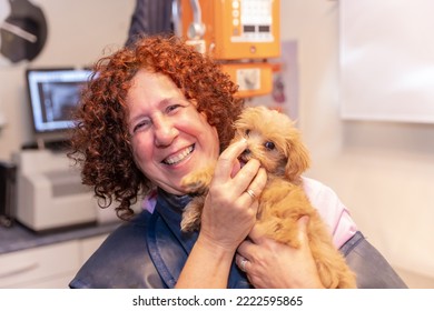 Veterinary Clinic, Portrait Of A Female Veterinarian With A Small Dog