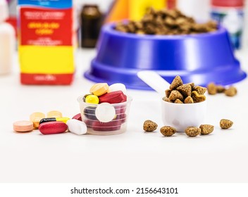 Veterinary Pills Or Medication, Supplements Or Vitamins For Pets, With Pet Food In The Background, With Copyspace