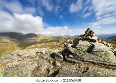 Vews of Great Gable and Green Gable from the mountain summit cairn of Seathwaite Fell in the English Lake District.