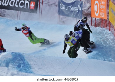 VEYSONNAZ, SWITZERLAND - JANUARY 15:  FIS World Championship Snowboard Cross finals. Finalist Drew Neilson leads Alex Pullin on January 15, 2010 in Veysonnaz, Switzerland