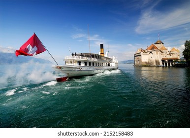 Veytaux, Vaud, Switzerland, Europe - 08.16.2008 : Steamboat Passing Chillon Castle Occupied Since Bronze Age, Located Between Lake Geneva Shore And Alps, Most Visited Historic Monument In Switzerland