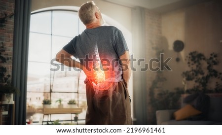 VFX Back Pain Augmented Reality Animation. Close Up of a Senior Male Experiencing Discomfort in a Result of Spine Trauma or Arthritis. Man Massaging and Stretching the Back to Ease the Injury. Сток-фото © 