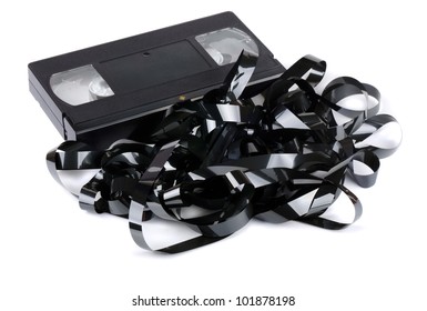 VHS Video Cassette With Tangled Video Tape Isolated On White