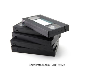 VHS Video Cassette Tapes Stacked, Isolated On White. Blank Label.