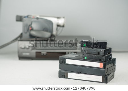 VHS videotapes, video player and video camera