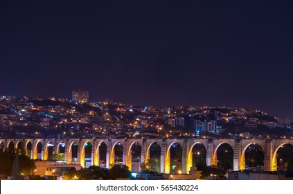 The Viaduct Of Queretaro City And Its Skyline At Night, Mexico.