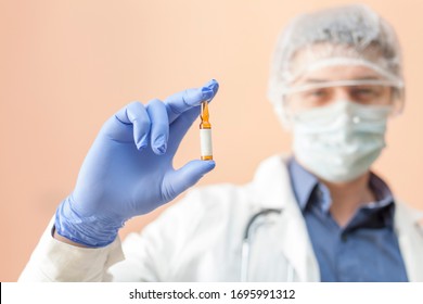 vial, ampoule in hand, palm or fingers. Medical equipment for plastic vaccination with a needle. Doctor holds a coronavirus vaccine. Liquid drug or drug. Medical care in the hospital - Shutterstock ID 1695991312