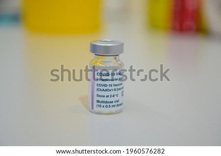 Vial of Covid-19 vaccination. Protection of Coronavirus. Bottle for injection with pharmaceuticals at vaccination center. Mass immunization.