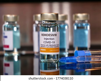 Vial of drug remdesivir with syringe for covid 19 coronavirus treatment