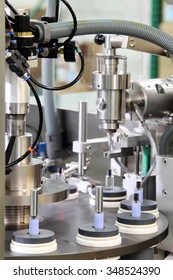 A vial filling machine in a cosmetics factory.