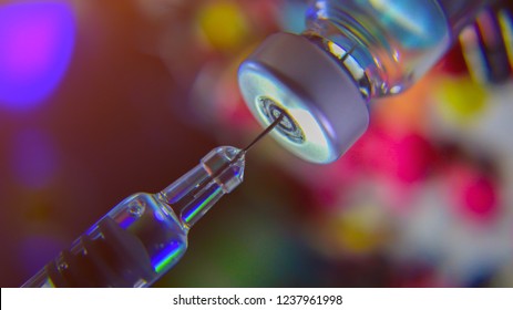 Vial vaccine drug and needle syringe hypodermic injection glass,concept immunization prevention for care flu shot ill virus baby child in hospital . selective focus
