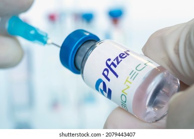 Vials of liquid the logos pfizer and biontech in the doctor's hand. March 15, 2021. Barnaul, Russia.