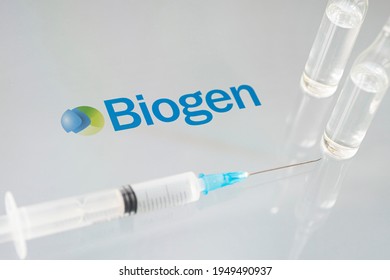 Vials of liquid on a white table and the logo Biogen, large pharmaceutical company. March 15, 2021. Barnaul, Russia.