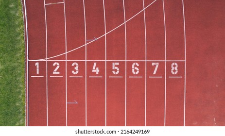 Viana do Castelo, Portugal, December 18, 2021: Manuela Machado Municipal Stadium. Eight empty red tracks for running sports with tartan track of synthetic rubber on the athletic stadium.