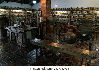 VIANOPOLIS - BETIM, MINAS GERAIS / BRAZIL - JAN 2, 2016: View of Cachaca museum with some vintage equipment and a collection of sugarcane liquor bottles in Vale Verde - Alembic and Ecological Park.