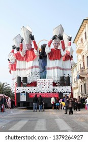 VIAREGGIO, ITALY - MARCH 4, 2012: Festive procession during the renowned Viareggio carnival parade. Spectacular floats depicting caricatures of popular politicians, celebrities or current events.