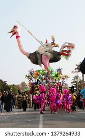 VIAREGGIO, ITALY - MARCH 4, 2012: Festive procession during the renowned Viareggio carnival parade. Spectacular floats depicting caricatures of popular politicians, celebrities or current events.