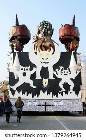 VIAREGGIO, ITALY - MARCH 4, 2012: Festive procession during the renowned Viareggio carnival parade. Spectacular floats depicting caricatures of popular politicians, celebrities or current events.