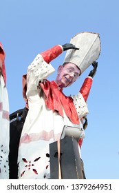 VIAREGGIO, ITALY - MARCH 4, 2012: Festive procession during the renowned Viareggio carnival parade. Spectacular floats depicting caricatures of popular politicians, celebrities or current events.