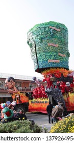 VIAREGGIO, ITALY - MARCH 4, 2012: Festive procession during the renowned Viareggio carnival parade. Spectacular floats depicting caricatures of popular politicians, celebrities or current events.