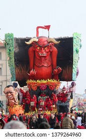 VIAREGGIO, ITALY - MARCH 4, 2012: Festive procession during the renowned Viareggio carnival parade. Spectacular floats depicting caricatures of popular politicians, celebrities or current events.