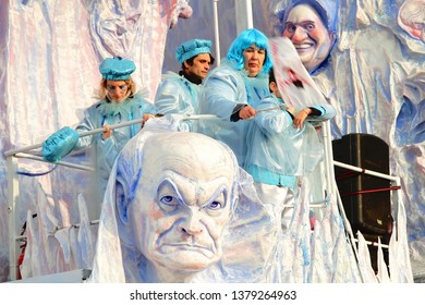 VIAREGGIO, ITALY - MARCH 4, 2012: Festive procession during the renowned Viareggio carnival parade. Spectacular floats depicting caricatures of popular politicians, celebrities or current events.