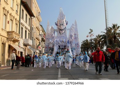 VIAREGGIO, ITALY - MARCH 4, 2012: Festive procession during the renowned Viareggio carnival parade. Spectacular floats depicting caricatures of popular politicians, celebrities or current events.