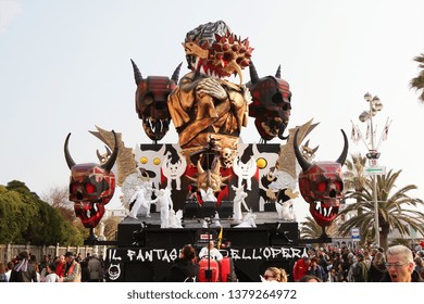 VIAREGGIO, ITALY - MARCH 4, 2012: Festive procession during the renowned Viareggio carnival parade. Spectacular floats depicting caricatures of popular politicians, celebrities or current events.