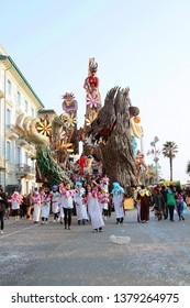 VIAREGGIO, ITALY - MARCH 4, 2012: Festive procession during the renowned Viareggio carnival parade. Spectacular floats depicting caricatures of popular politicians, celebrities or current events.