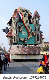 VIAREGGIO, ITALY - MARCH 4, 2012: Festive procession during the renowned Viareggio carnival parade. Spectacular floats depicting caricatures of popular politicians, celebrities or current events.